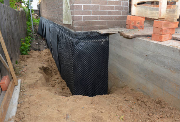 SJ Waterproofing Pros technician performing targeted Waterproofing assessment in Kingston Springs, TN